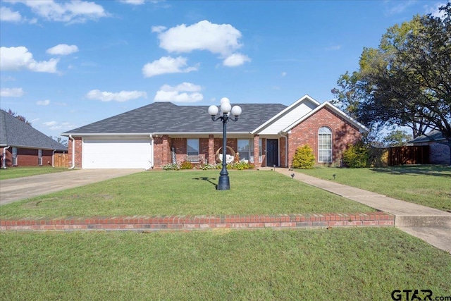 ranch-style home with a garage and a front yard