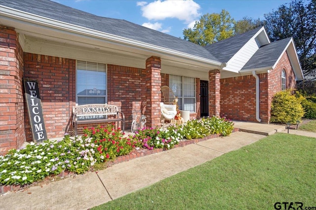 property entrance featuring covered porch