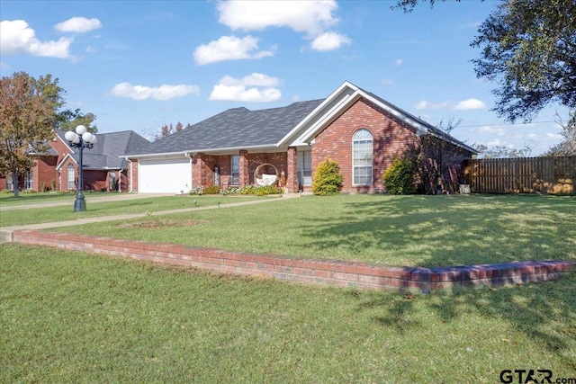 ranch-style home featuring a front lawn and a garage