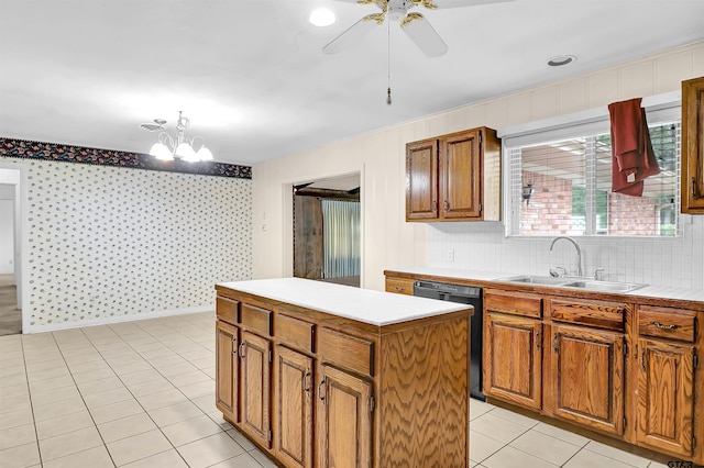 507 Tullie Dr, Longview, TX 75601 - kitchen featuring dishwashing machine, a sink, a center island, light tile patterned flooring, and brown cabinets