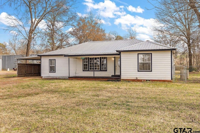 ranch-style house with a carport and a front yard