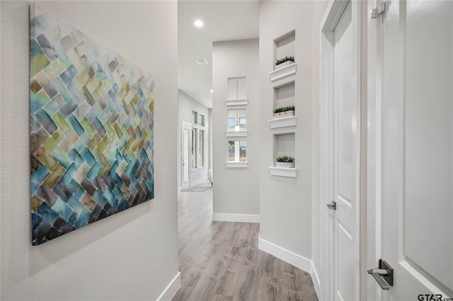 hall featuring light hardwood / wood-style floors