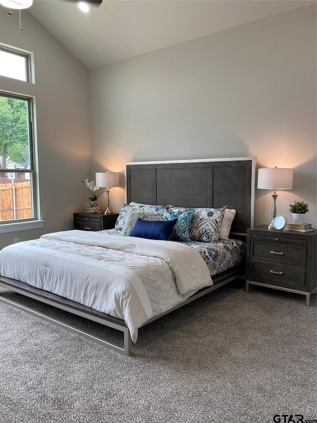 carpeted bedroom featuring vaulted ceiling