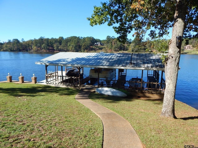 view of dock featuring a lawn and a water view