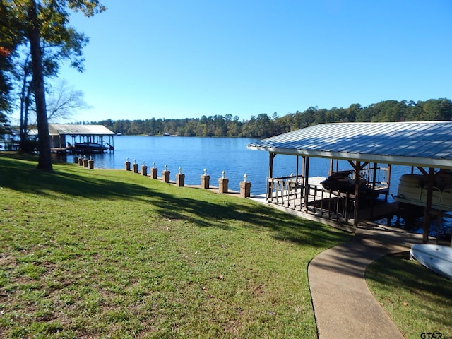 view of dock featuring a water view and a yard