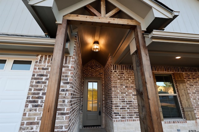 doorway to property with a garage