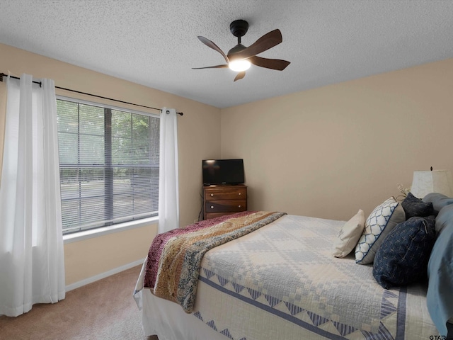184 Shiprock Path, Holly Lake Ranch, TX 75765 - carpeted bedroom featuring a textured ceiling and ceiling fan