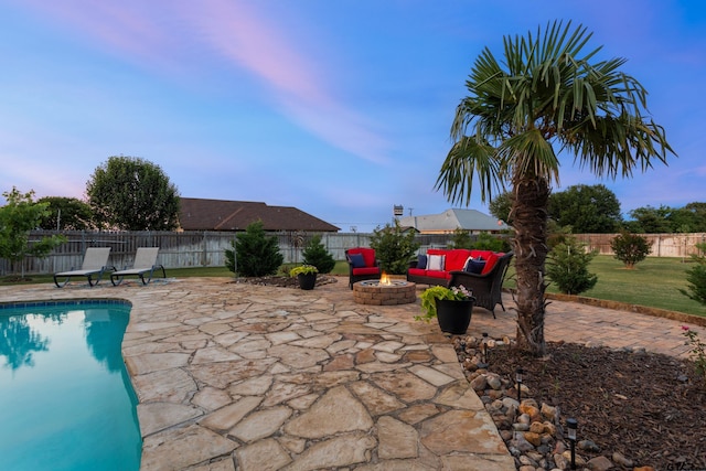 16050 Stonebriar Ct, Lindale, TX 75771 - pool at dusk featuring a patio, a fenced backyard, and an outdoor living space with a fire pit