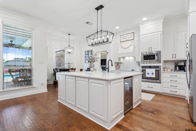 16050 Stonebriar Ct, Lindale, TX 75771 - kitchen with stainless steel appliances, wine cooler, a chandelier, tasteful backsplash, and recessed lighting