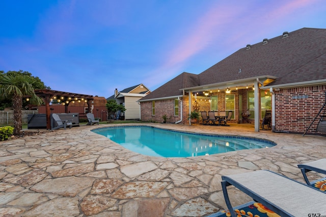 16050 Stonebriar Ct, Lindale, TX 75771 - pool at dusk featuring a hot tub, a patio, outdoor dining area, and a pergola