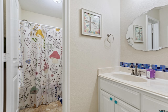 16050 Stonebriar Ct, Lindale, TX 75771 - bathroom with vanity, backsplash, a shower with curtain, and a textured wall