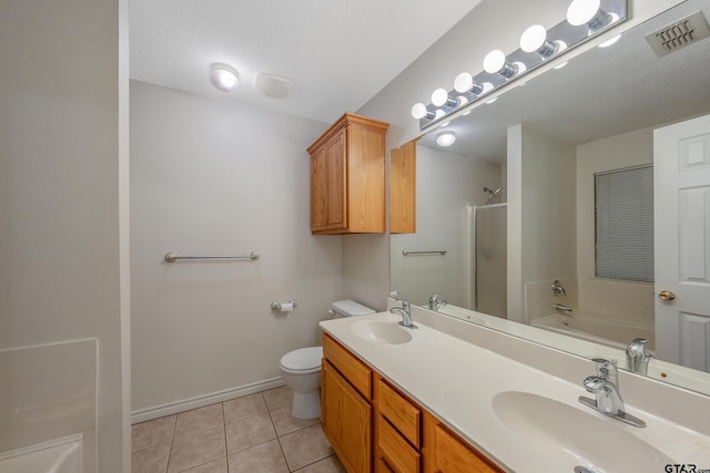 full bathroom with a textured ceiling, vanity, plus walk in shower, tile patterned floors, and toilet