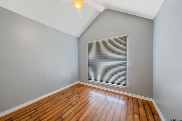 spare room featuring lofted ceiling, hardwood / wood-style flooring, and ceiling fan