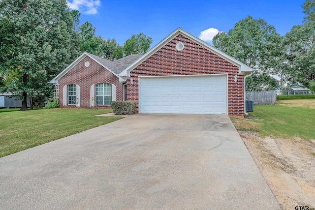 view of front of house featuring a garage and a front lawn