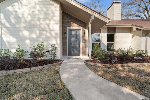 property entrance with a yard