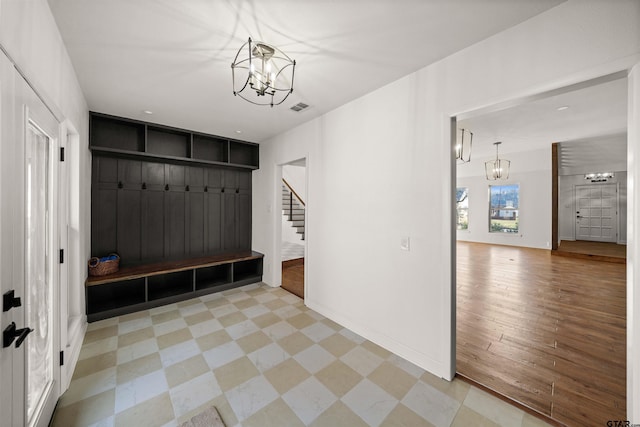 3829 Cloverdale Dr, Tyler, TX 75701 - mudroom featuring a chandelier and baseboards