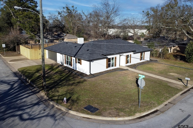 411 W Heritage Dr, Tyler, TX 75703 - view of front of home with a shingled roof, stucco siding, and driveway