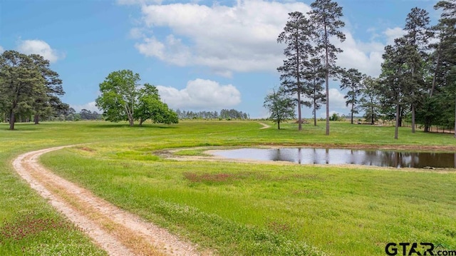 273 Fm 2276, Kilgore, TX 75662 - view of property's community featuring a lawn and a water view