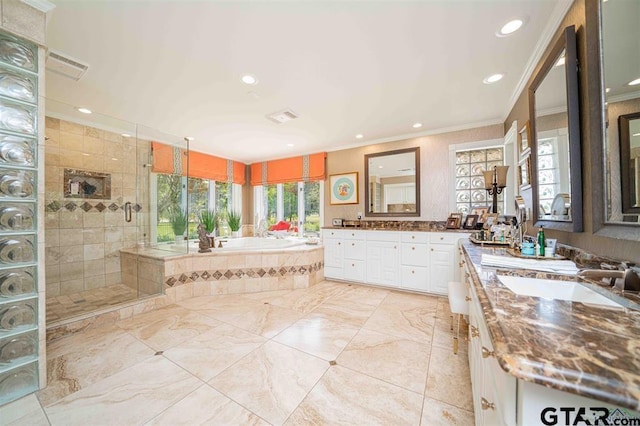273 Fm 2276, Kilgore, TX 75662 - bathroom featuring crown molding, recessed lighting, tiled shower, and a garden tub