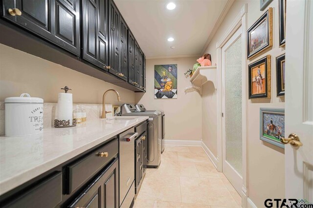 273 Fm 2276, Kilgore, TX 75662 - clothes washing area featuring independent washer and dryer, cabinet space, a sink, baseboards, and ornamental molding