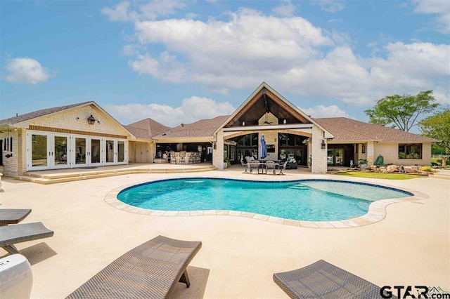 273 Fm 2276, Kilgore, TX 75662 - outdoor pool with french doors and a patio area