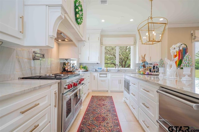 273 Fm 2276, Kilgore, TX 75662 - kitchen featuring decorative backsplash, double oven range, crown molding, light stone countertops, and white cabinets
