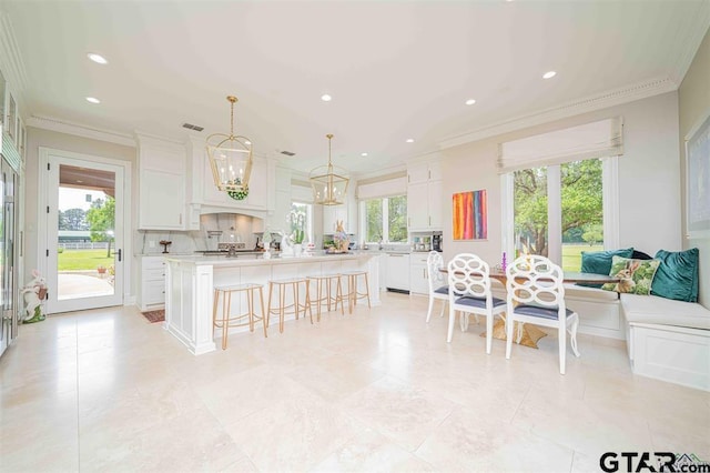 273 Fm 2276, Kilgore, TX 75662 - kitchen featuring recessed lighting, light countertops, a breakfast bar area, and a wealth of natural light