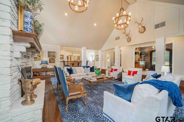 273 Fm 2276, Kilgore, TX 75662 - living room featuring ornate columns, high vaulted ceiling, dark wood finished floors, and visible vents