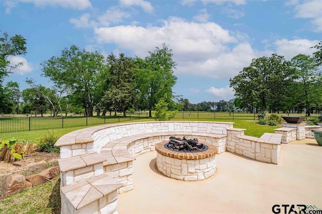 273 Fm 2276, Kilgore, TX 75662 - view of patio featuring a fire pit and a fenced backyard