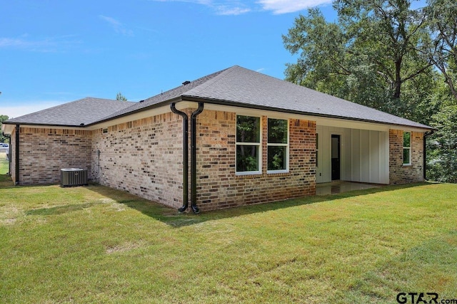 437 Tara Ln, Troup, TX 75789 - view of side of property featuring a yard, brick siding, board and batten siding, and a shingled roof