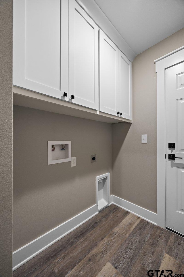 437 Tara Ln, Troup, TX 75789 - laundry area with cabinet space, electric dryer hookup, dark wood-style floors, and washer hookup