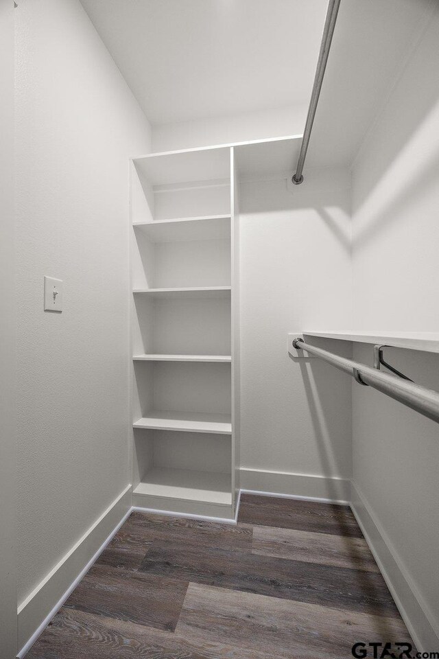 437 Tara Ln, Troup, TX 75789 - walk in closet with dark wood finished floors