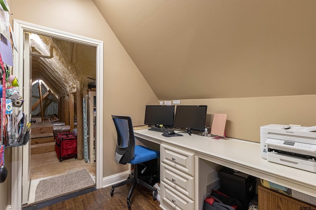 office with dark hardwood / wood-style floors and lofted ceiling