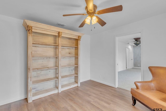 unfurnished room with ceiling fan and light hardwood / wood-style floors