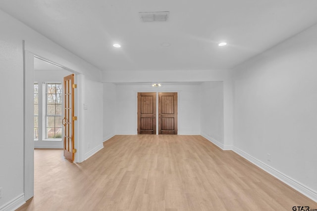 unfurnished room with light hardwood / wood-style flooring