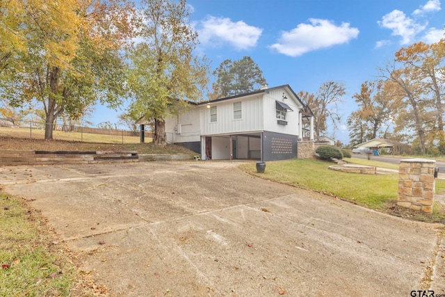 exterior space with a yard and a carport