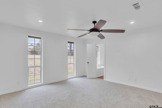 carpeted empty room with ceiling fan