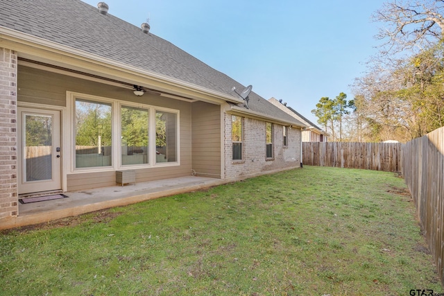 back of property featuring a patio area, ceiling fan, and a yard