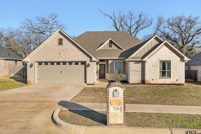 view of front of home featuring a garage and a front lawn