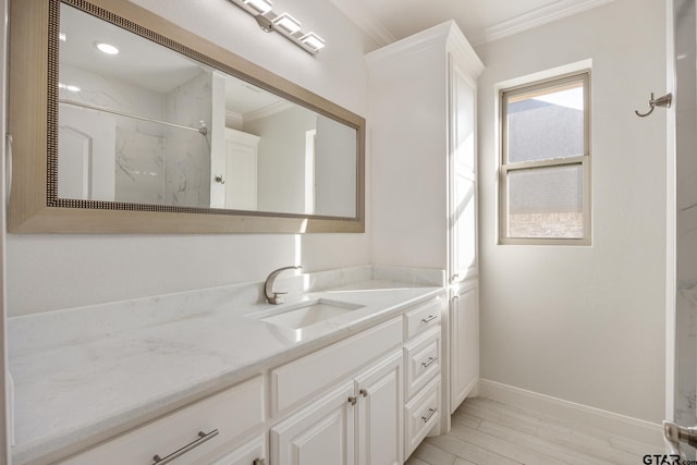 bathroom with a shower, crown molding, hardwood / wood-style floors, and vanity