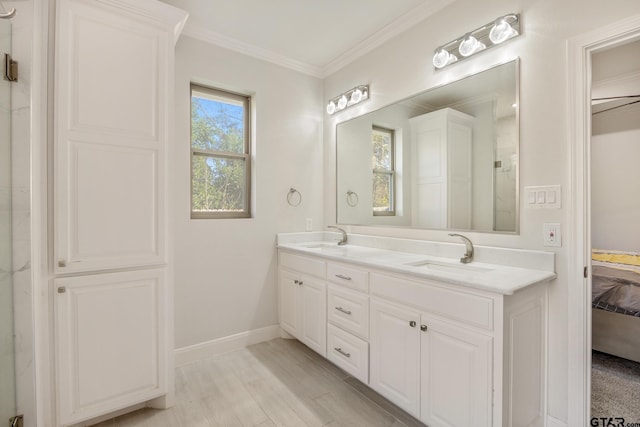 bathroom with vanity, hardwood / wood-style flooring, and ornamental molding