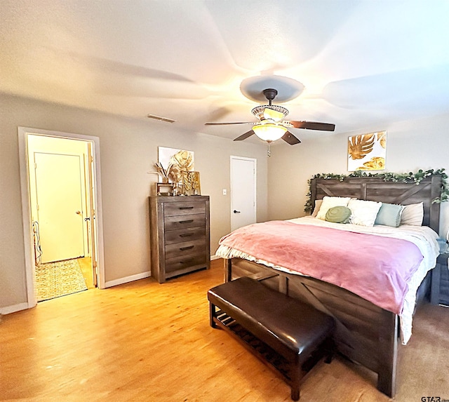 bedroom featuring hardwood / wood-style floors and ceiling fan