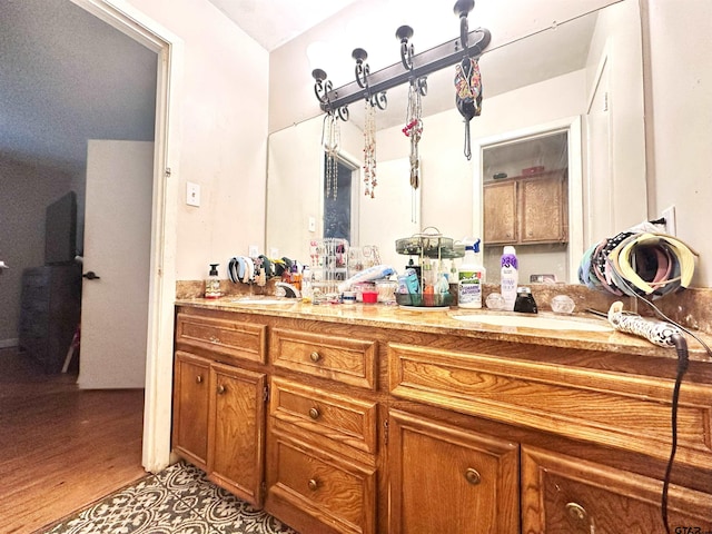 bathroom featuring hardwood / wood-style flooring and vanity