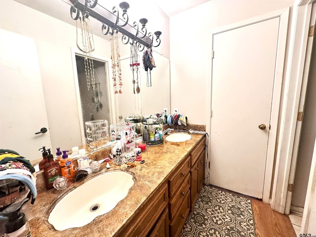 bathroom featuring wood-type flooring and vanity