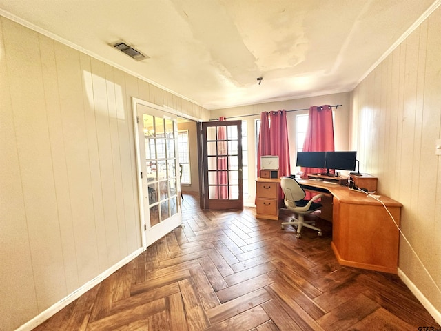 office space with a wealth of natural light, dark parquet flooring, and crown molding