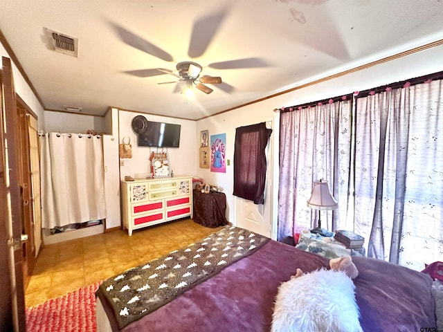 bedroom with ceiling fan and tile patterned floors