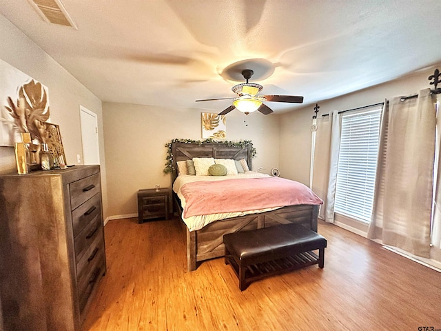 bedroom featuring ceiling fan and light wood-type flooring