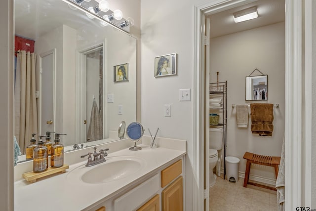 bathroom featuring vanity and toilet