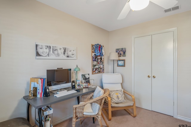 office space featuring light colored carpet and ceiling fan