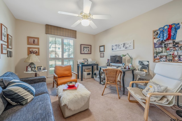 carpeted office featuring ceiling fan